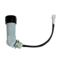 Right-angle photocell with a black sensor cap, gray body and wired plug connector