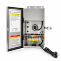 Open silver transformer enclosure with two reset buttons, a terminal block and a coiled power cord