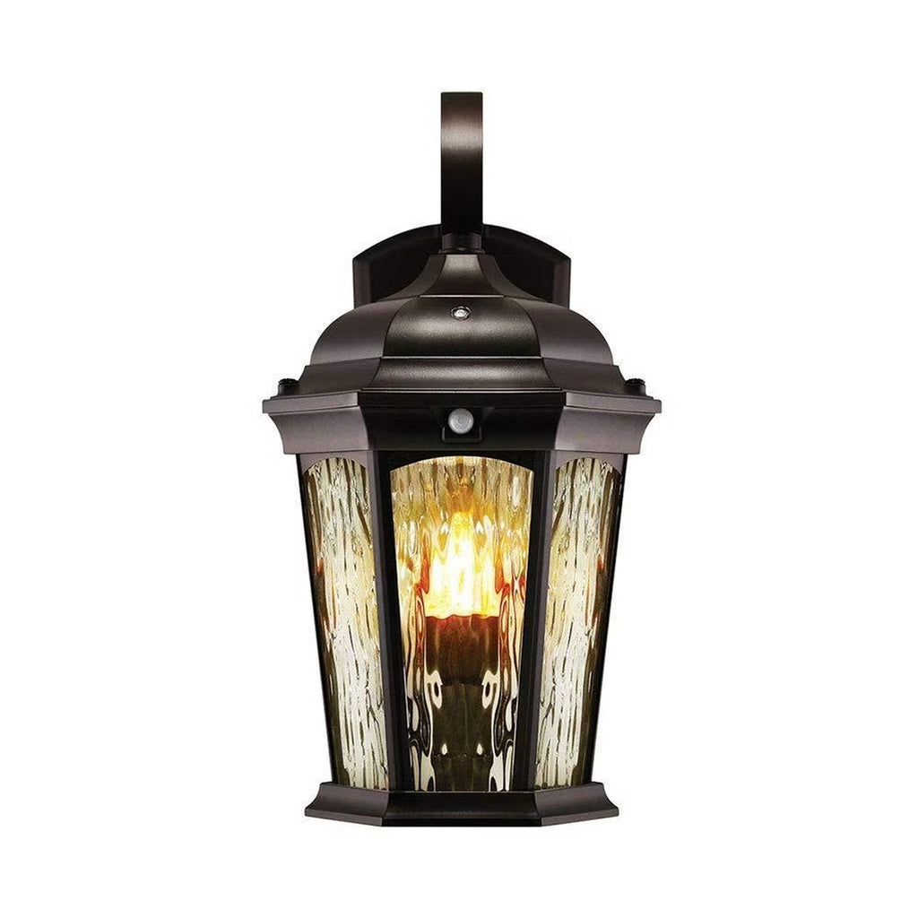 Bronze wall lantern isolated with flame illumination