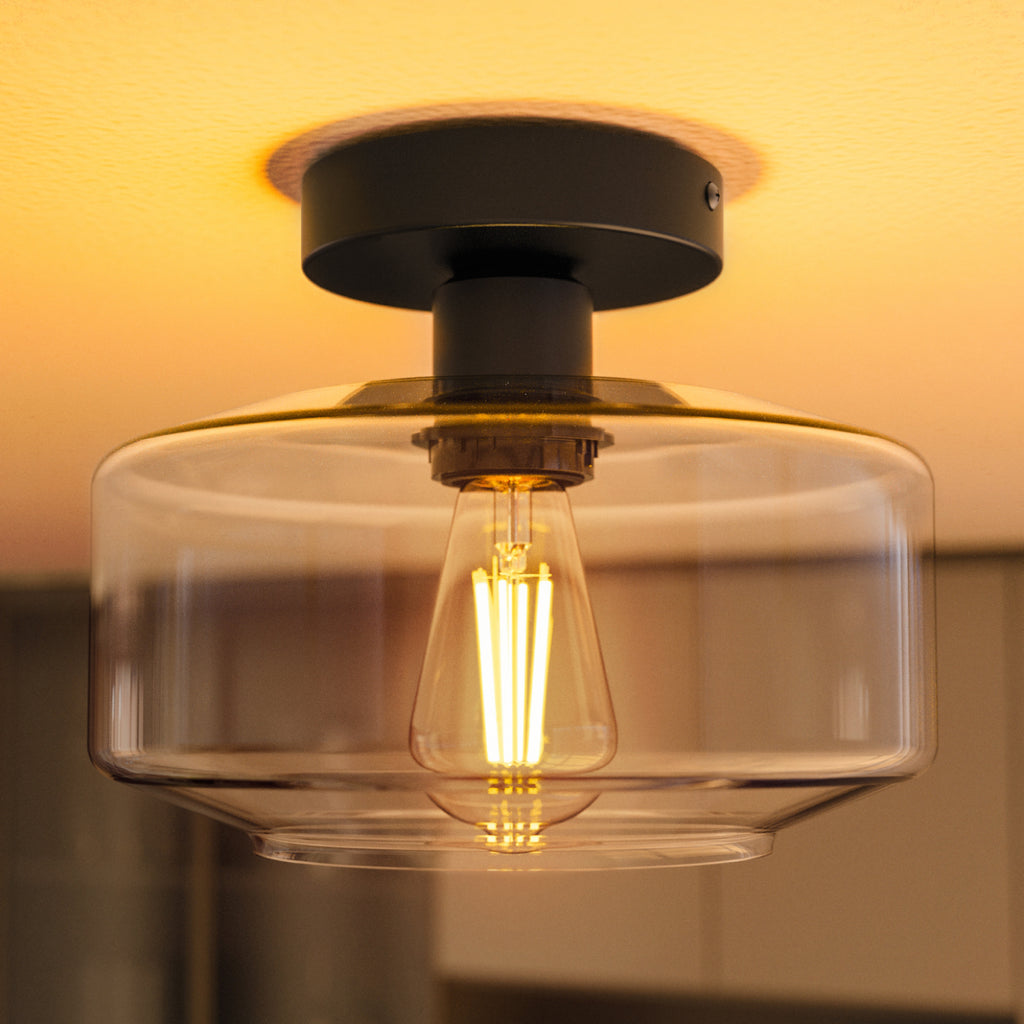 Crafted with a sturdy metal base and a crystal-clear glass shade for lasting beauty.