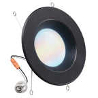 Black baffle retrofit downlight with frosted lens, spring clips, orange connector, and E26 adapter.