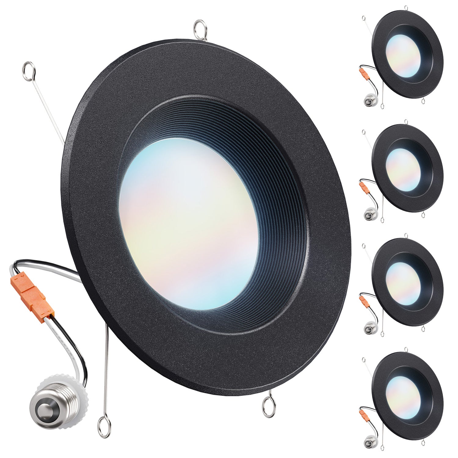 Four black retrofit downlights with glowing frosted lenses, spring clips, orange connectors, and E26 adapters.
