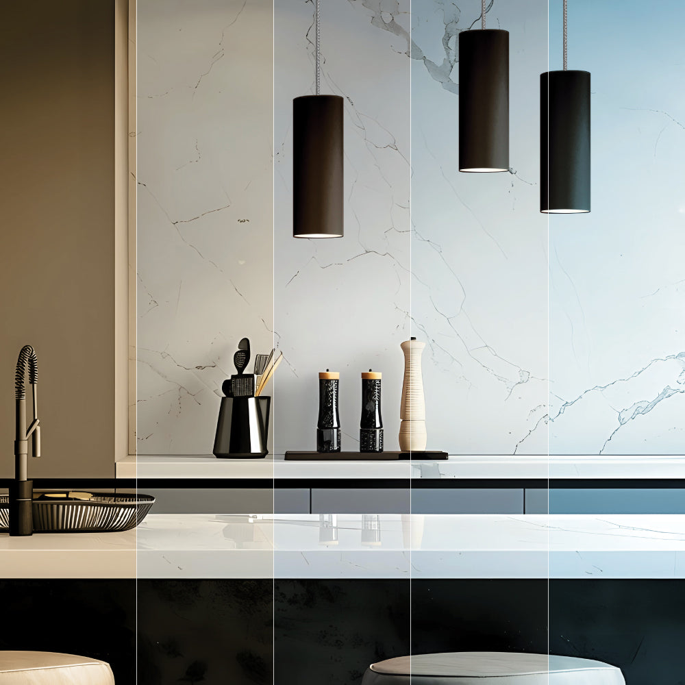 Black cylinder pendants over kitchen work surface