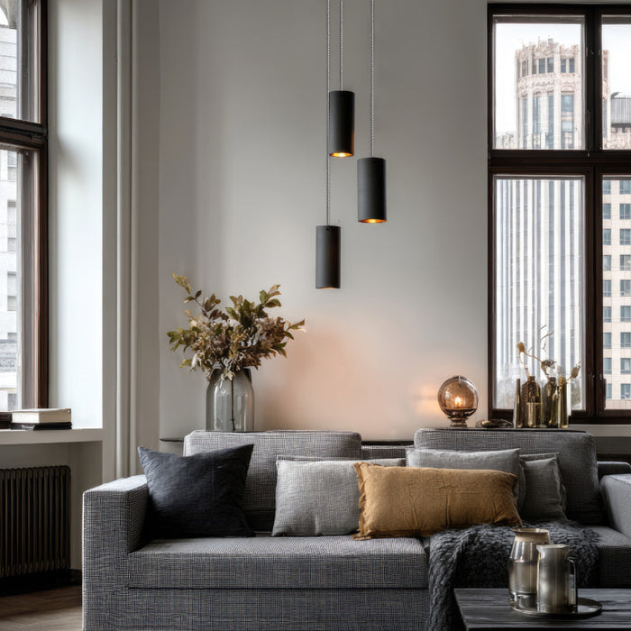 Black cylinder pendants in living-room application
