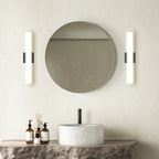 Black linear vanity lights mounted vertically at mirror