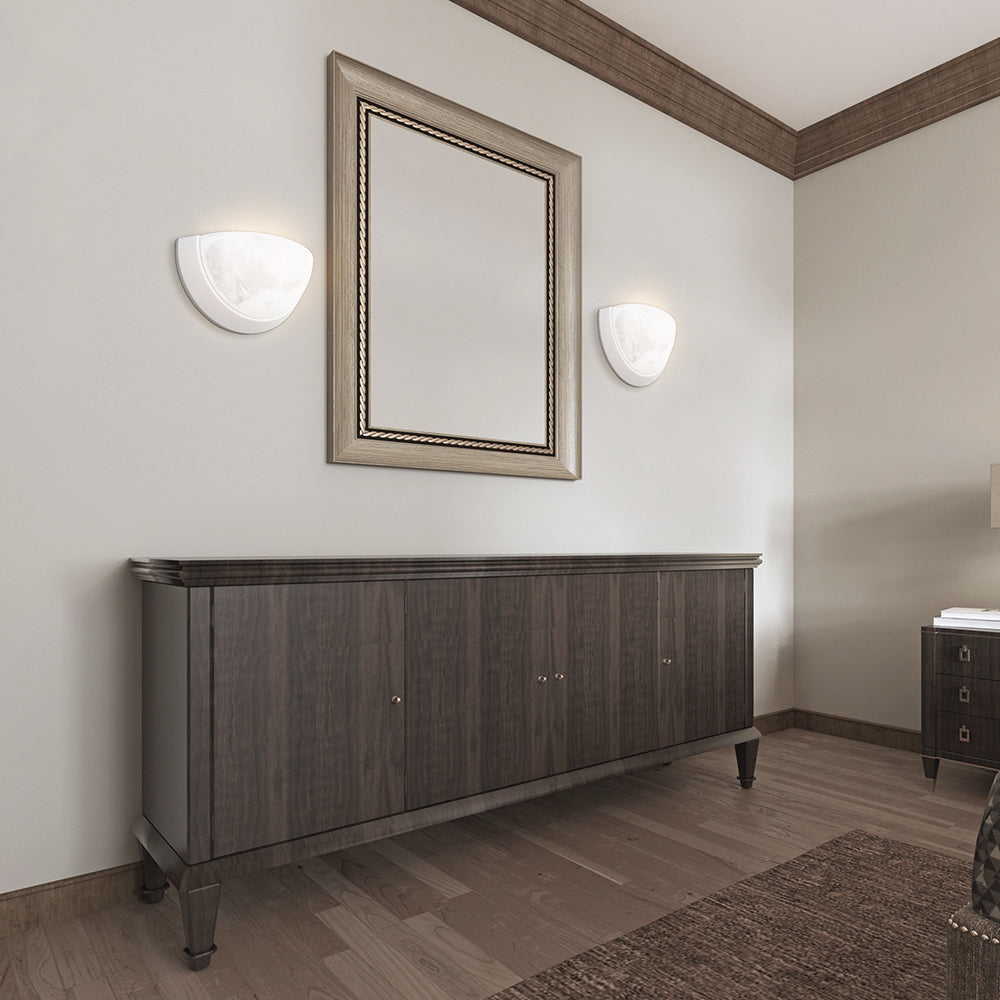 White bowl wall sconces around bathroom mirror