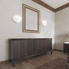 White bowl wall sconces around bathroom mirror