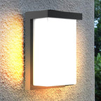 Short black rectangular wall light installed illuminated