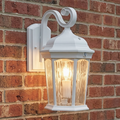 White S-arm wall lantern installed illuminated