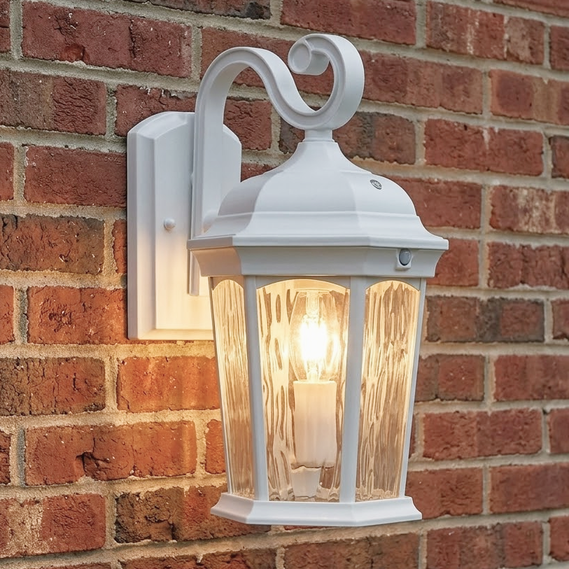 White S-arm wall lantern installed illuminated