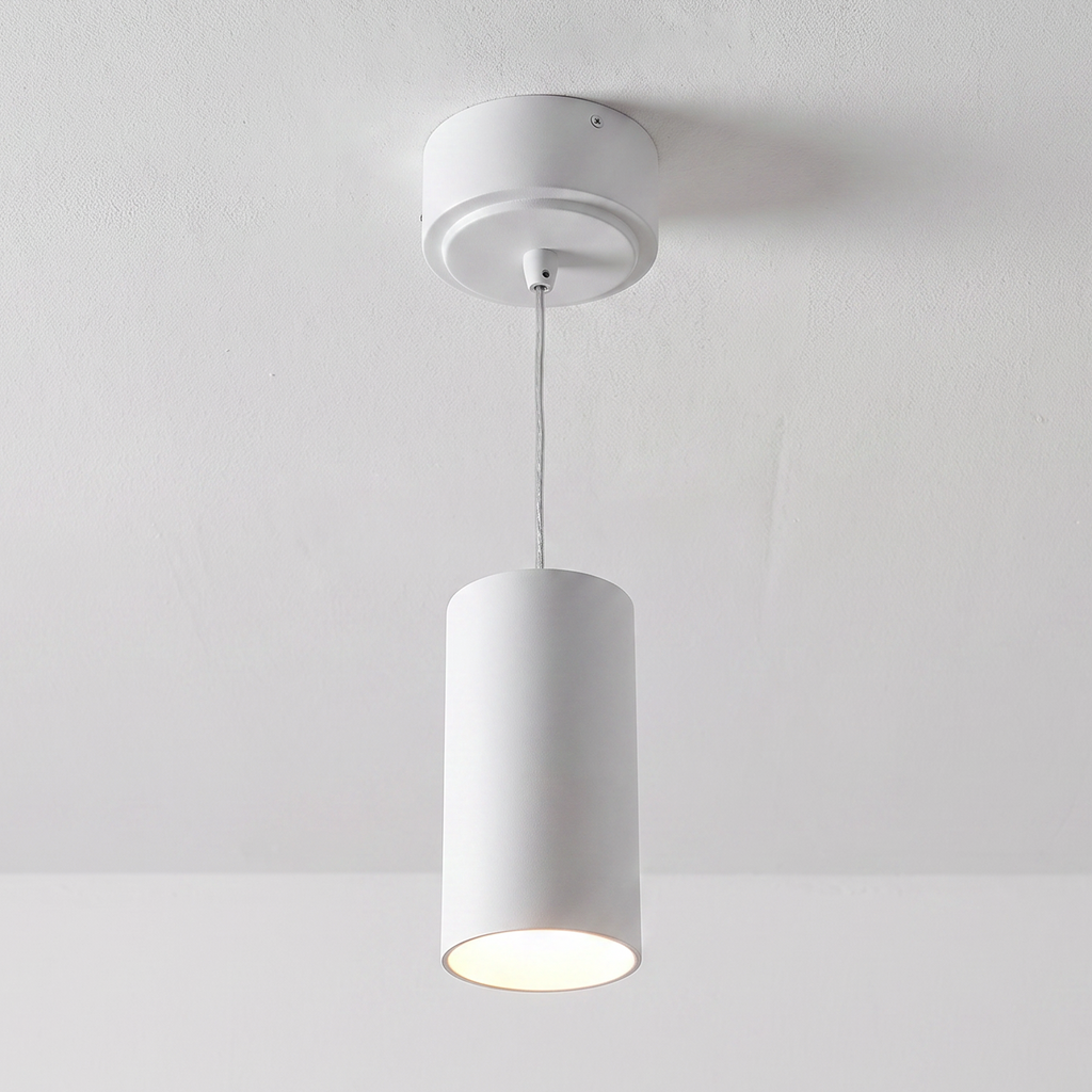 White cylinder pendant installed illuminated