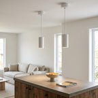 White cylinder pendants in living-room application