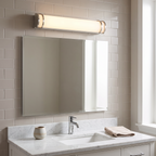 Brushed-nickel short tube vanity light above mirror