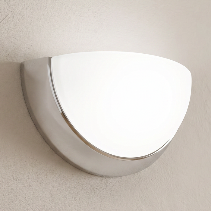 Brushed-nickel bowl wall sconce installed illuminated