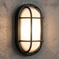Black oval bulkhead wall light installed illuminated