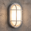 White oval bulkhead wall light installed illuminated