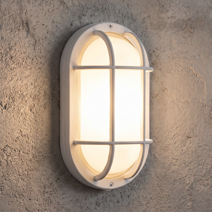 White oval bulkhead wall light installed illuminated