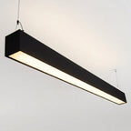 Black architectural linear pendant installed illuminated