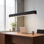 Black architectural linear pendant over desk