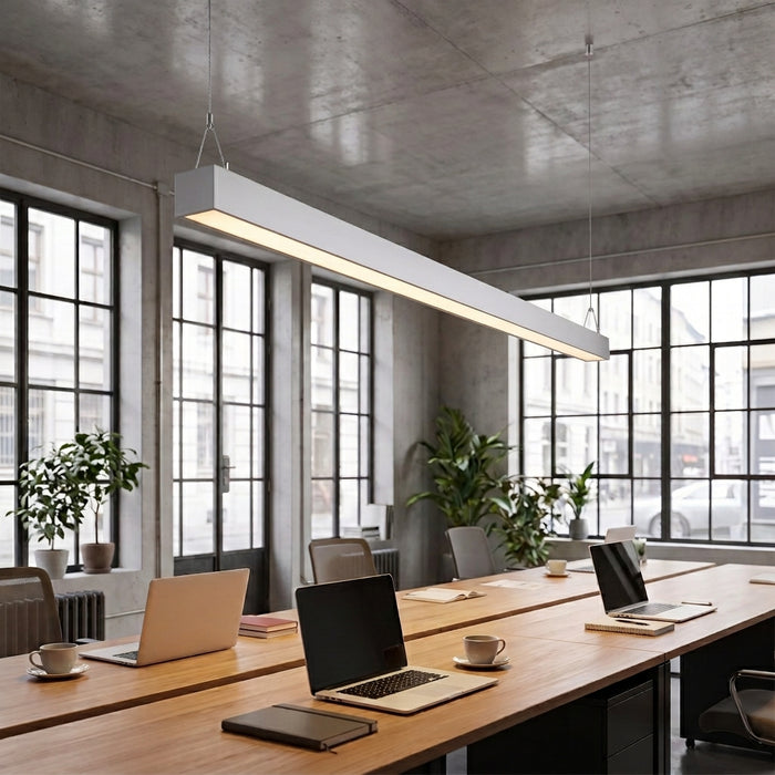 Silver architectural linear pendant over shared desk