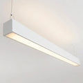 White architectural linear pendant installed illuminated