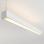 White architectural linear pendant installed illuminated