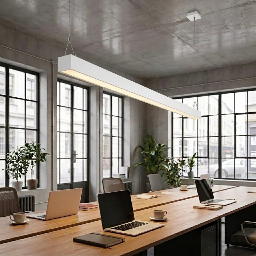 White architectural linear pendant over shared desk