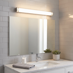 Brushed-nickel long tube vanity light above mirror