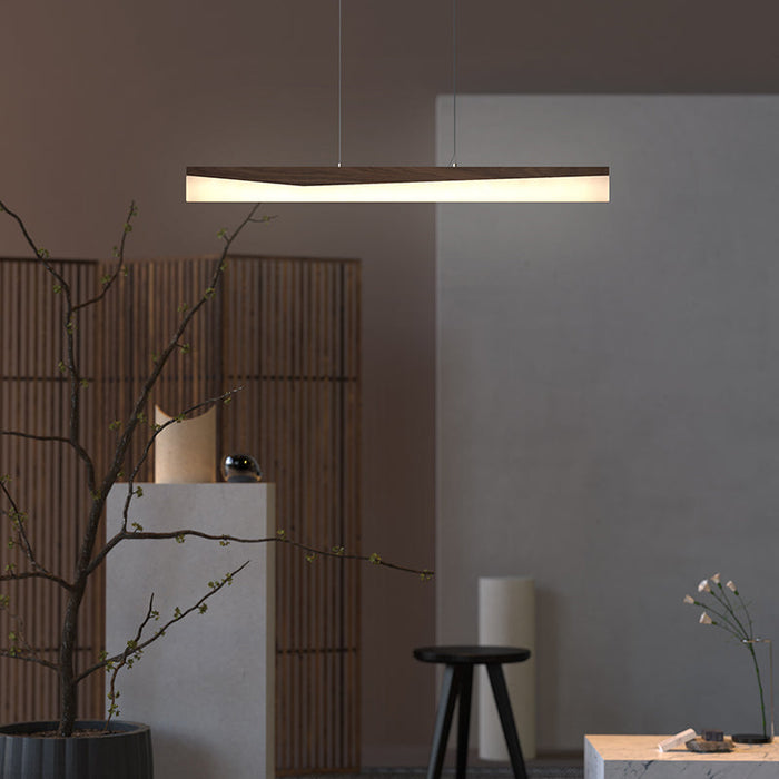 Walnut trough-profile pendant over dining table