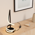 Sculptural Curve LED Table Lamp — in a room setting