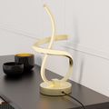 Golden Swirl LED Table Lamp — in a room setting
