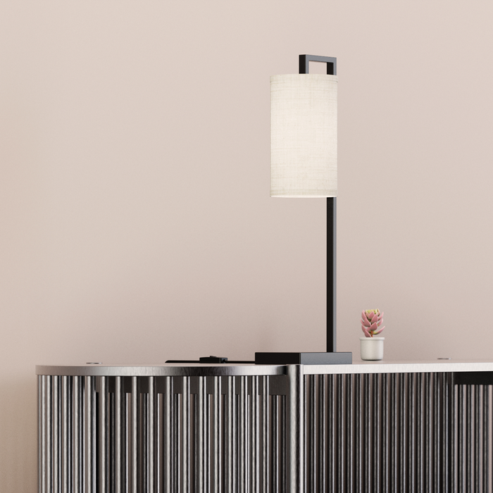 Rectangular Frame Table Lamp with Cylinder Shade — in a room setting