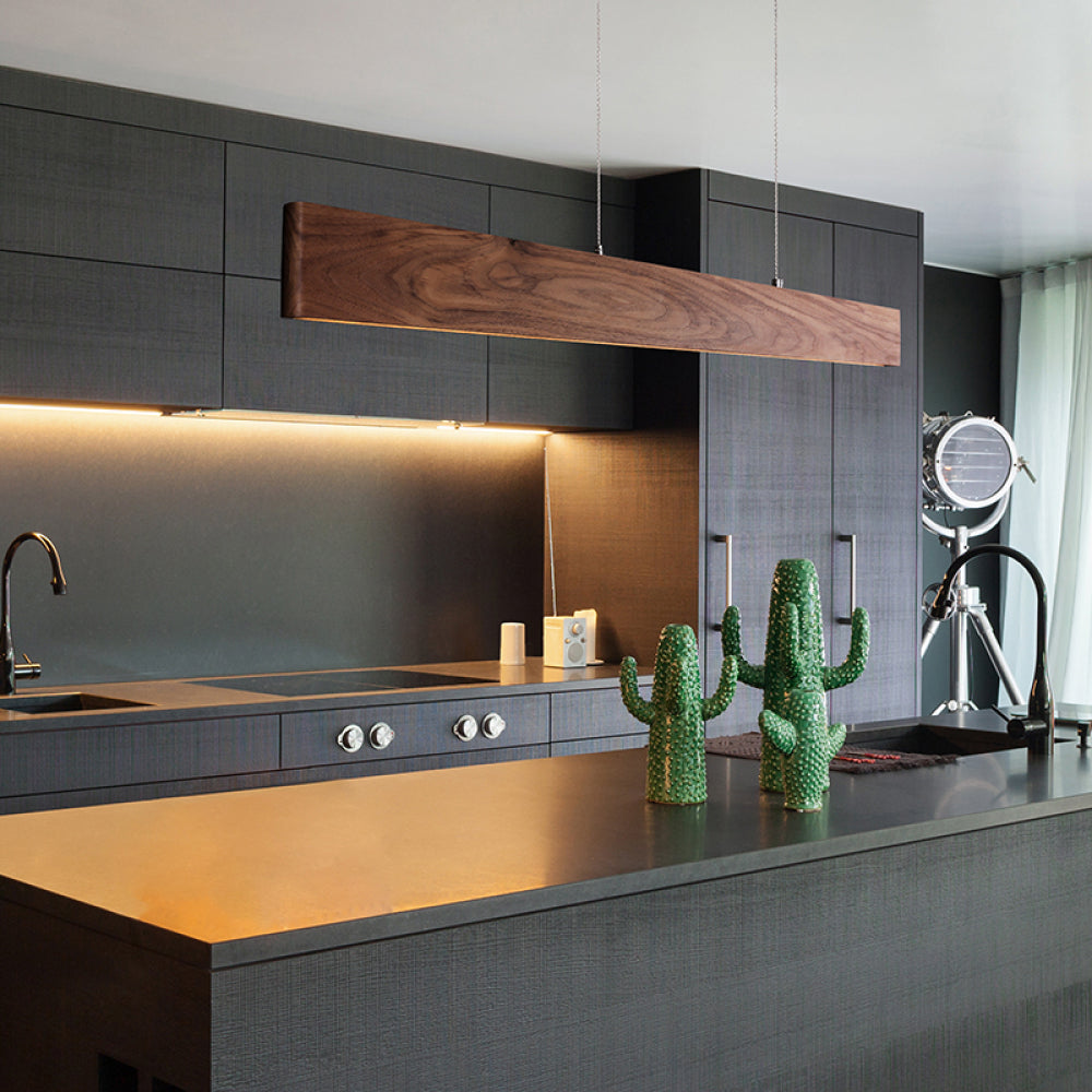 Walnut linear pendant over kitchen island