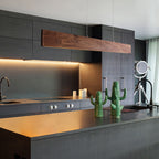 Walnut linear pendant over kitchen island