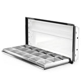 Open parabolic troffer housing. 2x4 troffer with parabolic louver hinged down, white housing and black frame up and open on white background