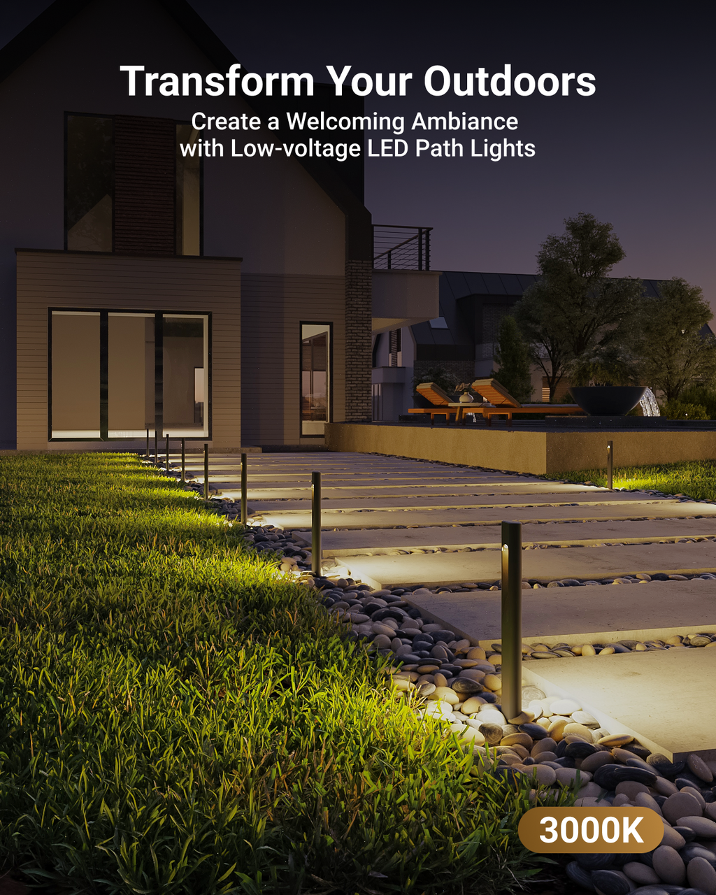 Row of slim black rectangular low-voltage LED path lights cast a warm 3000K yellowish glow on a concrete pathway to a house