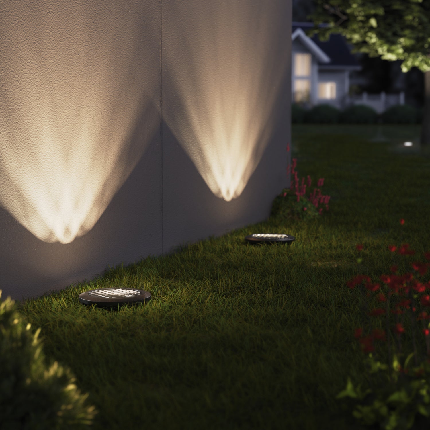 Sunco low voltage in-ground light lights up the exterior sides of buildings with warm light.