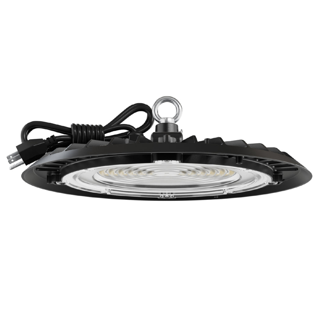 UFO high bay light side view. Black UFO high bay LED with coiled plug cord and hanging eyelet; lens and heat-sink fins visible