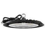 UFO high bay light side view. Black UFO high bay LED with coiled plug cord and hanging eyelet; lens and heat-sink fins visible