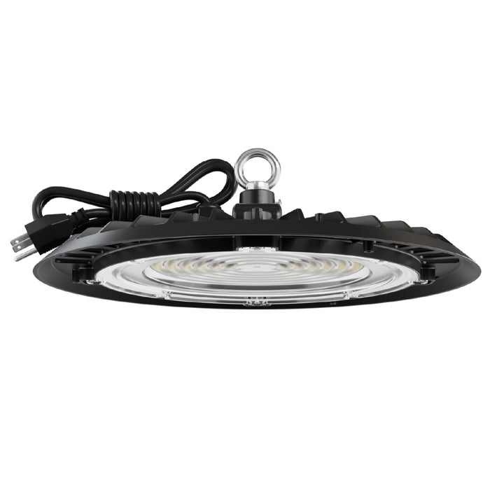 UFO high bay light side view. Black UFO high bay LED with coiled plug cord and hanging eyelet; lens and heat-sink fins visible