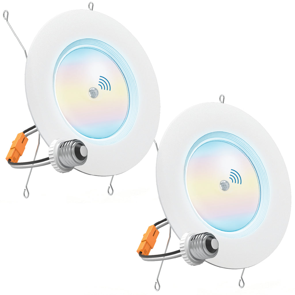 Two white retrofit downlights with E26 adapters, orange connectors, spring clips, and PIR motion sensor icons.