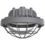A gray industrial LED light fixture with a protective cage and ribbed top housing, shown against a plain white background.