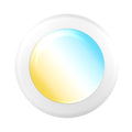 Angled close up of a white disk light lens. Warm to cool gradient suggests selectable CCT lighting.

