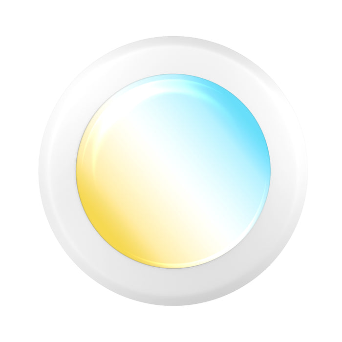 Angled close up of a white disk light lens. Warm to cool gradient suggests selectable CCT lighting.
