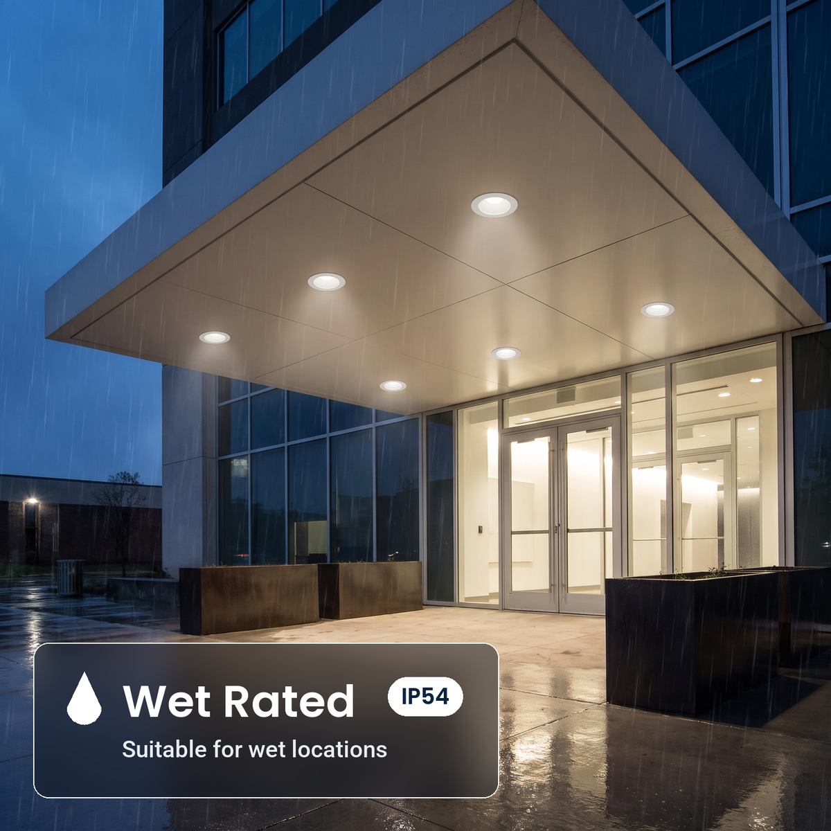 Wet rated 10 inch white commercial LED downlights in a building entrance canopy (IP54)