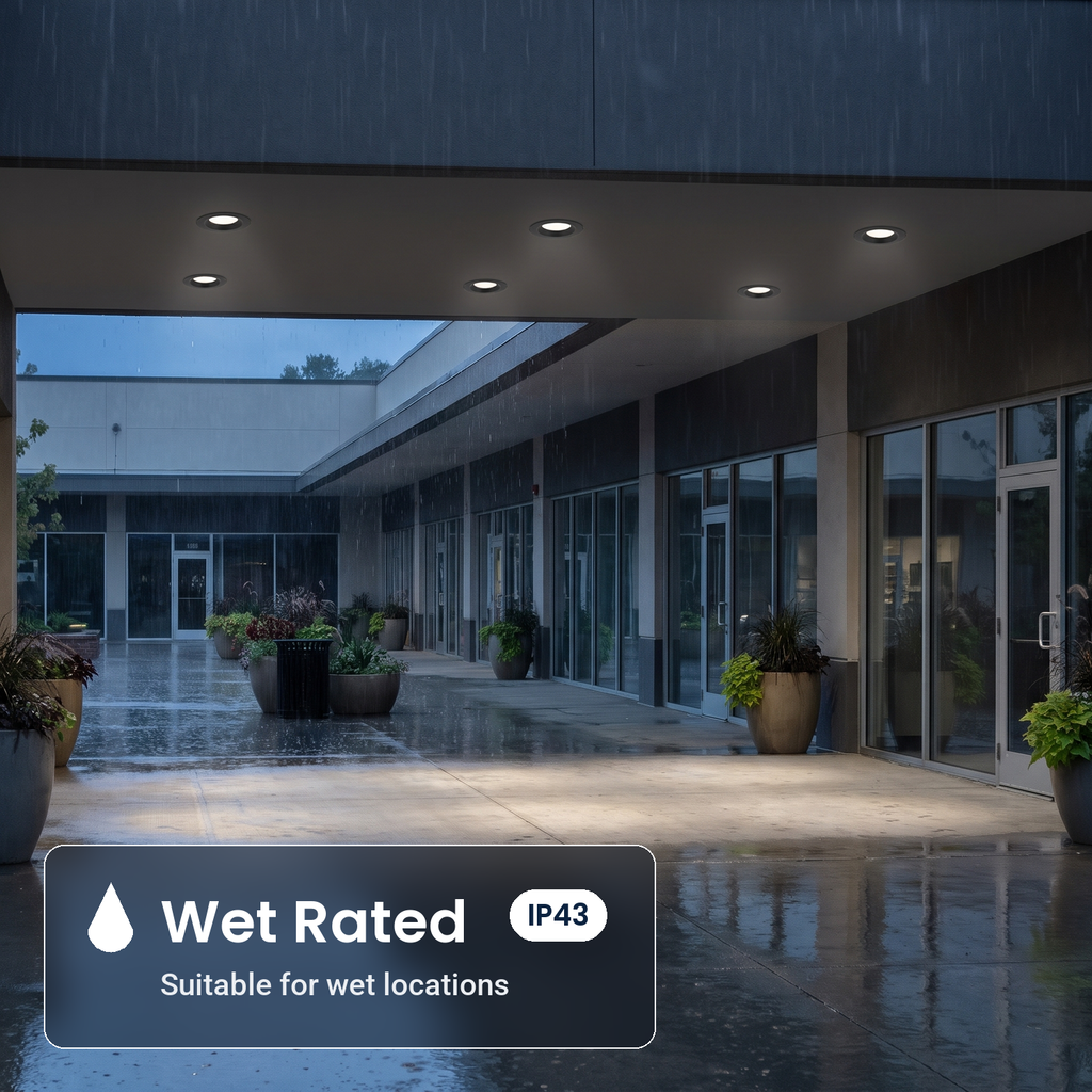 Wet rated 8 inch black commercial LED downlights in a covered mall walkway (IP43)