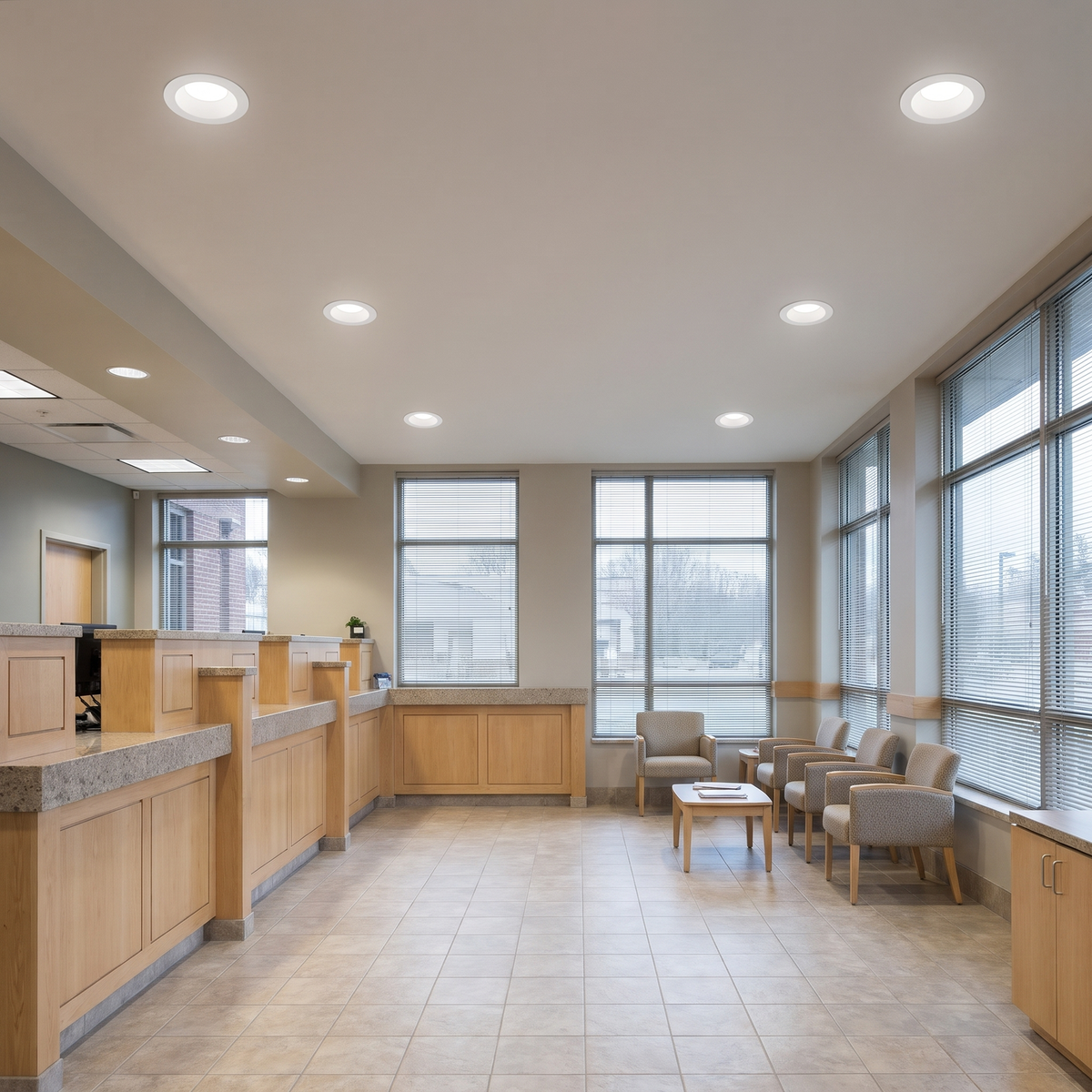 8 inch white commercial LED downlights with battery backup in a bank lobby