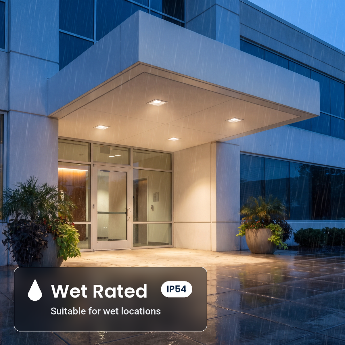 Wet rated 6 inch white square commercial LED downlights in a building entrance canopy (IP54)