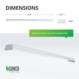 Dimensions of the 5-inch Wraparound Prisma LED Shop Light are length: 4ft, width: 5.4 inches, height: 2.55 inches. This is a seamless, direct mount light fixture with a minimal look. Image shows the shop light flush mounted against the ceiling. The slim profile helps these lights blend into your ceiling.